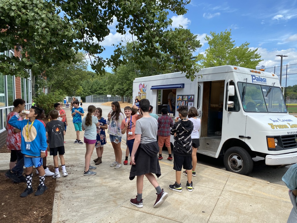 Students visiting an ice cream truck.