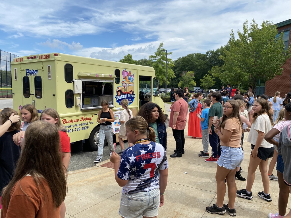 Students visiting an ice cream truck.