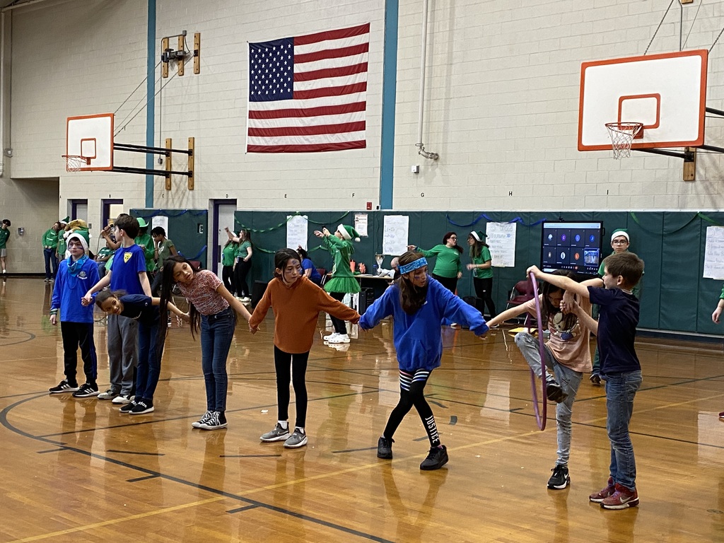 Students passing a hula hoop